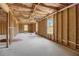 Unfinished basement with framed walls and window at 215 Eryn Ter, Covington, GA 30014