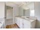 Bathroom with double vanity and view into bedroom at 215 Eryn Ter, Covington, GA 30014