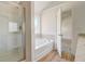 Bathroom with soaking tub and walk-in shower at 215 Eryn Ter, Covington, GA 30014
