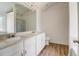 Double vanity bathroom with a large mirror at 215 Eryn Ter, Covington, GA 30014