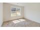 Well-lit bedroom with large window and wall-to-wall carpet at 215 Eryn Ter, Covington, GA 30014