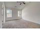 Large bedroom with two windows and carpet flooring at 215 Eryn Ter, Covington, GA 30014