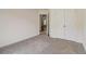 Bright bedroom with neutral carpeting and double closets at 215 Eryn Ter, Covington, GA 30014