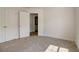 Spacious bedroom with neutral carpeting and double closets at 215 Eryn Ter, Covington, GA 30014
