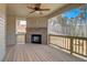 Spacious covered deck with fireplace and wooded views at 215 Eryn Ter, Covington, GA 30014