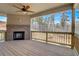 Spacious covered deck with fireplace and wooded views at 215 Eryn Ter, Covington, GA 30014