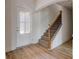 Light and bright entryway with hardwood floors and a staircase at 215 Eryn Ter, Covington, GA 30014