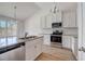 Modern kitchen with stainless steel appliances and granite countertops at 215 Eryn Ter, Covington, GA 30014