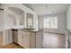 Kitchen features a large island with granite and stainless steel appliances at 215 Eryn Ter, Covington, GA 30014