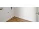 Laundry room with vinyl flooring and built-in shelving at 215 Eryn Ter, Covington, GA 30014