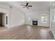 Bright living room features hardwood floors, fireplace, and vaulted ceiling at 215 Eryn Ter, Covington, GA 30014