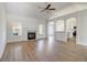 Spacious living room with hardwood floors, a fireplace, and an open floor plan at 215 Eryn Ter, Covington, GA 30014