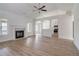 Spacious living room with hardwood floors, a fireplace, and an open floor plan at 215 Eryn Ter, Covington, GA 30014