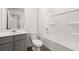 Clean bathroom with gray vanity and bathtub at 285 Kenoot Dr, Mcdonough, GA 30253