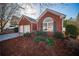 Brick home with two-car garage and neatly landscaped yard at 4976 Centennial Hill Walk Nw Dr, Acworth, GA 30102