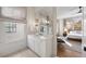 Elegant bathroom with a large mirror and white cabinetry at 803 Courtenay Ne Dr, Atlanta, GA 30306