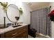 Modern bathroom featuring black and white checkered shower curtain, vanity with granite counter at 1045 Paper Creek Dr, Lawrenceville, GA 30046