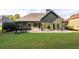 Home's backyard with patio, and pergola at 305 Mogie Ln, Acworth, GA 30102