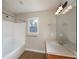 Bathroom with single vanity, shower/tub combo, and window at 305 Mogie Ln, Acworth, GA 30102