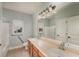 Clean bathroom with double vanity and shower/tub combo at 305 Mogie Ln, Acworth, GA 30102