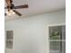 Well-lit bedroom featuring two windows and ceiling fan at 305 Mogie Ln, Acworth, GA 30102