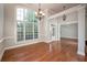 Spacious dining room with hardwood floors, large window and chandelier at 305 Mogie Ln, Acworth, GA 30102