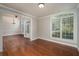Formal dining room with hardwood floors, large window and chandelier at 305 Mogie Ln, Acworth, GA 30102