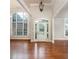 Bright entryway with hardwood floors, arched windows and a glass front door at 305 Mogie Ln, Acworth, GA 30102