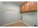 Laundry room with cabinets and shelving at 305 Mogie Ln, Acworth, GA 30102