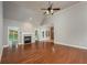 Spacious living room with hardwood floors, fireplace, and access to backyard at 305 Mogie Ln, Acworth, GA 30102