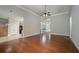 Open living room with hardwood floors and views into kitchen and foyer at 305 Mogie Ln, Acworth, GA 30102