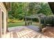 Relaxing patio with pergola, bench, and gravel at 305 Mogie Ln, Acworth, GA 30102