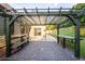 Outdoor patio with pergola, bench, and table at 305 Mogie Ln, Acworth, GA 30102