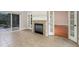 Sunroom with fireplace, tile floors, and sliding glass doors at 305 Mogie Ln, Acworth, GA 30102