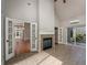 Sunroom features tile flooring, fireplace, and access to backyard at 305 Mogie Ln, Acworth, GA 30102