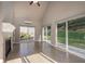 Sunroom with tile floors, fireplace, and sliding glass doors to backyard at 305 Mogie Ln, Acworth, GA 30102