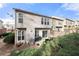 Exterior of the townhome including a patio with seating and a hammock and greenery in the backyard at 5800 Oakdale Se Rd # 165, Mableton, GA 30126