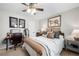 Comfortable bedroom boasts ample natural light, neutral paint, and ceiling fan for a serene space at 5800 Oakdale Se Rd # 165, Mableton, GA 30126