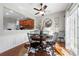 Bright dining room with hardwood floors, modern decor, and a view of the kitchen at 5800 Oakdale Se Rd # 165, Mableton, GA 30126