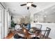 Open-concept view of dining and living spaces featuring modern decor and hardwood flooring at 5800 Oakdale Se Rd # 165, Mableton, GA 30126