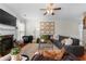 Comfortable living room with a fireplace, stylish decor, ample seating, and abundant natural light from large windows at 5800 Oakdale Se Rd # 165, Mableton, GA 30126