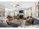 Bright living room featuring a fireplace, plush seating, a glass coffee table, and access to the dining area at 5800 Oakdale Se Rd # 165, Mableton, GA 30126