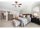 Spacious main bedroom featuring a ceiling fan, a king bed and access to the bathroom at 5800 Oakdale Se Rd # 165, Mableton, GA 30126