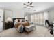 Bright and airy main bedroom with a ceiling fan and comfortable seating at 5800 Oakdale Se Rd # 165, Mableton, GA 30126