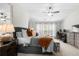 Spacious main bedroom with a ceiling fan and a cozy seating area at 5800 Oakdale Se Rd # 165, Mableton, GA 30126