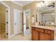 Bathroom with granite vanity, walk-in shower, and access to closets at 2005 Heathermere Way, Roswell, GA 30075