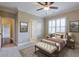 Well-lit bedroom with a comfortable bed and ensuite bathroom at 2005 Heathermere Way, Roswell, GA 30075