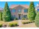 Brick two-story house with landscaping and walkway at 2005 Heathermere Way, Roswell, GA 30075