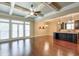 Open concept Gathering room with hardwood floors and kitchen view at 2005 Heathermere Way, Roswell, GA 30075