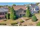 Brick two-story house with landscaping and walkway at 2005 Heathermere Way, Roswell, GA 30075